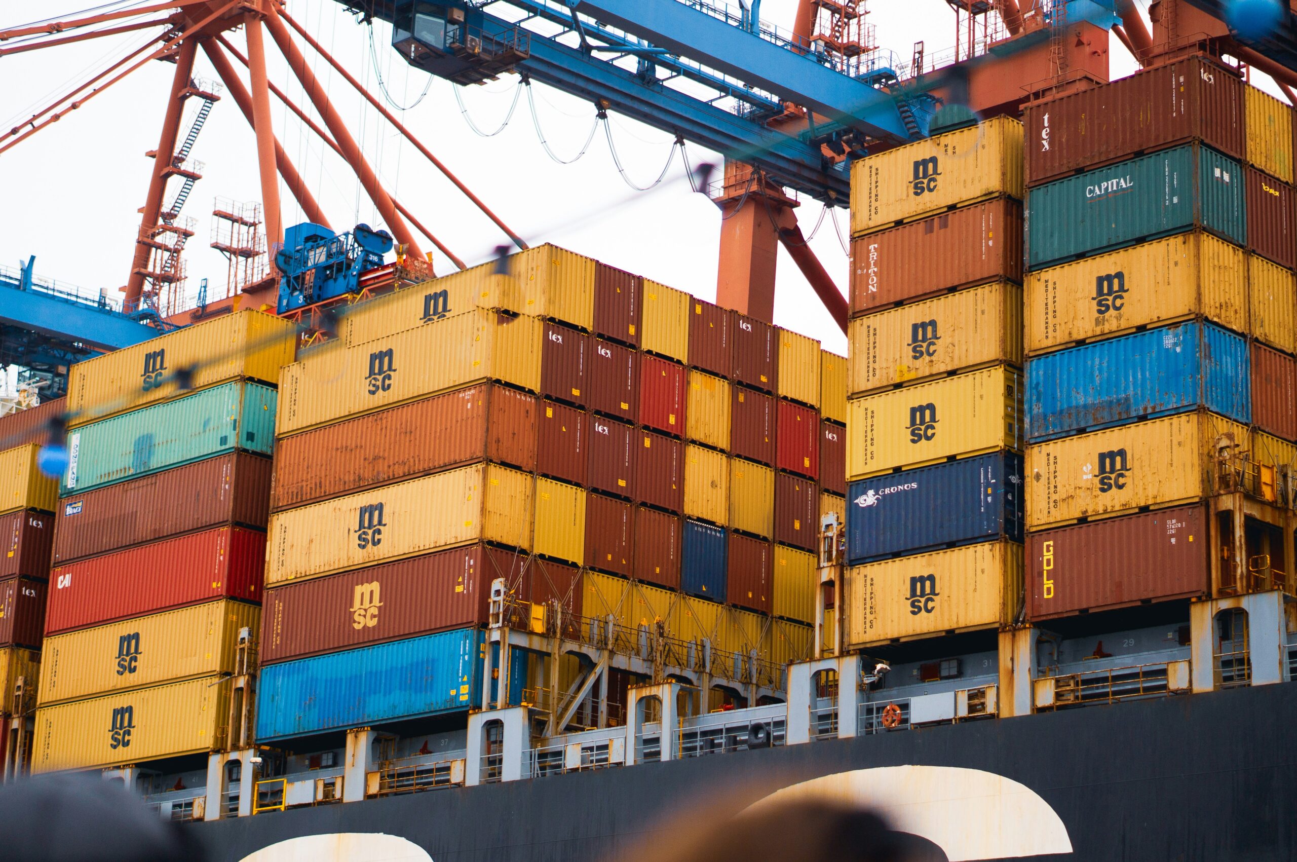 A large cargo ship loaded with lots of containers.